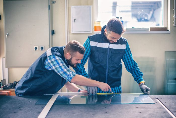 Two men cutting a glass | Fyshwick, ACT | EW Glass Two men cutting a glass | Fyshwick, ACT | EW Glass
