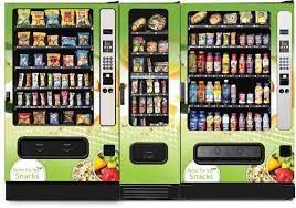 Three vending machines are lined up next to each other.