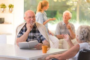 Man Holding Book — Lehi, UT — Bellaview Assisted Living