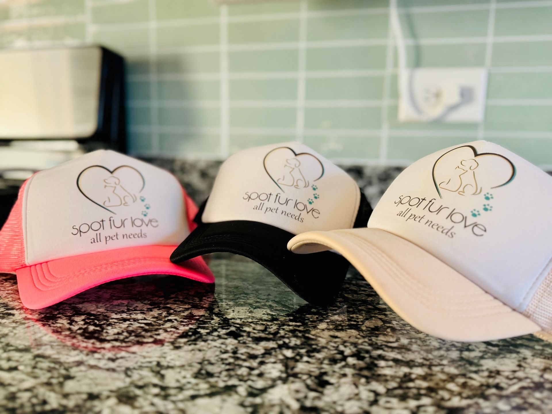 Three trucker hats with a logo that says 