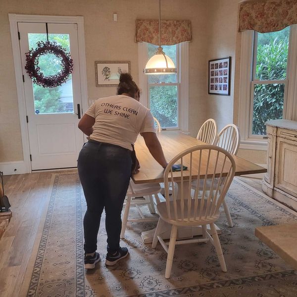 Woman Cleaning the Table — Cherry Hill, NJ — Ray of Sunshine Cleaning Woman Cleaning the Table — Cherry Hill, NJ — Ray of Sunshine Cleaning