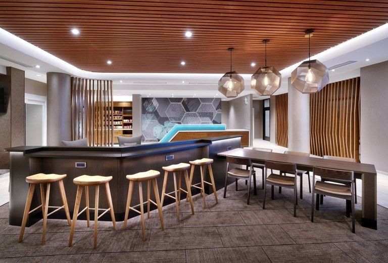 A room with a table and stools in it