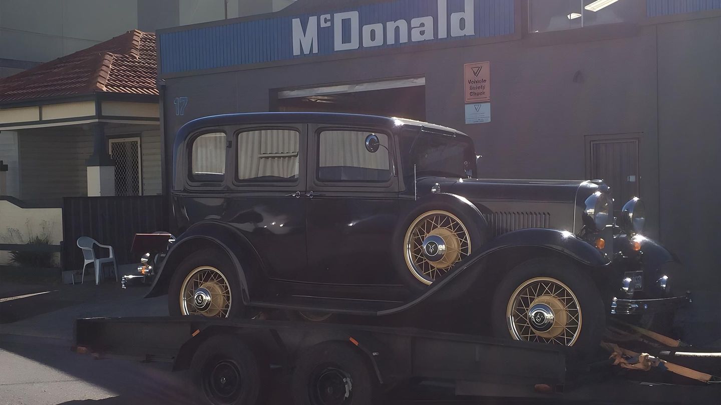An Old Car Is On A Trailer In Front Of A Mcdonald 's — McDonald Automotive Services In Islington, NSW