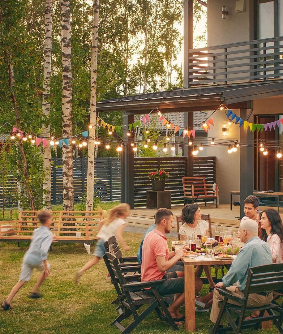 garden style dinner in backyard with vacationing family