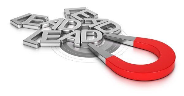 Red horseshoe magnet pulling metal letters spelling LEAD, representing tips to generate leads on your website