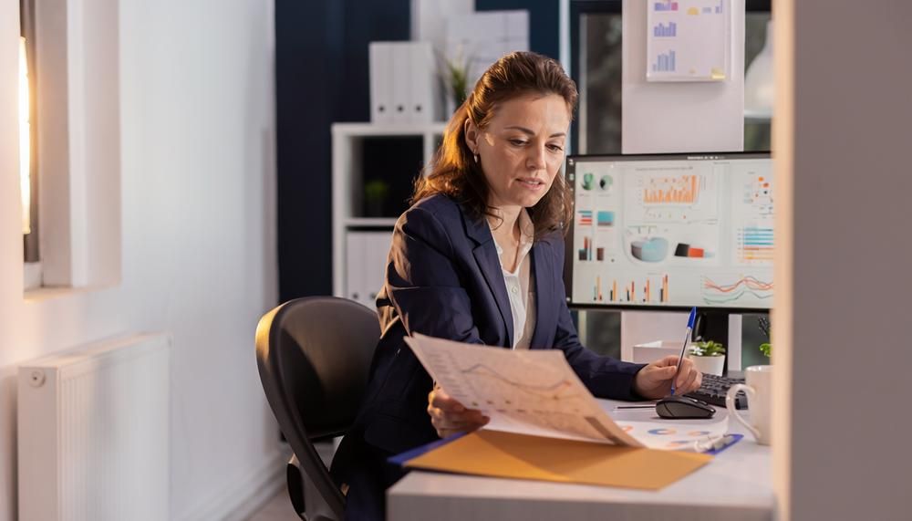 PMI strategist reviewing an analytics-driven marketing plan on screen in the Reading, Pennsylvania office