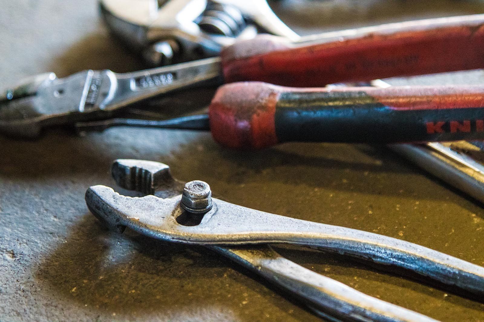 Close-up Of Worn Workshop Pliers And Hand Tools On A Workbench, Used For Mechanical Brake Repairs — Kings Brake Service Specialists in Tamworth, NSW