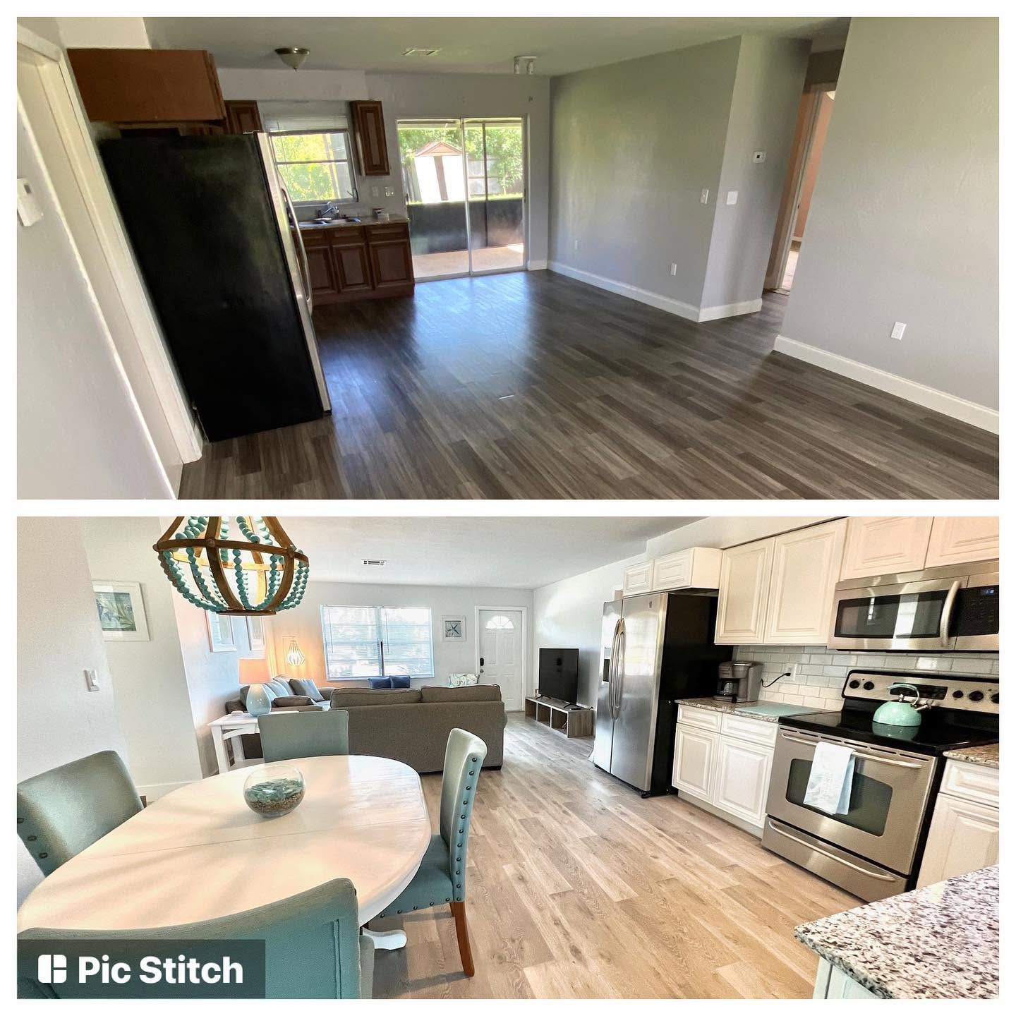 Empty open-plan kitchen and living area with wood-look floors, light cabinets, and stainless steel appliances.