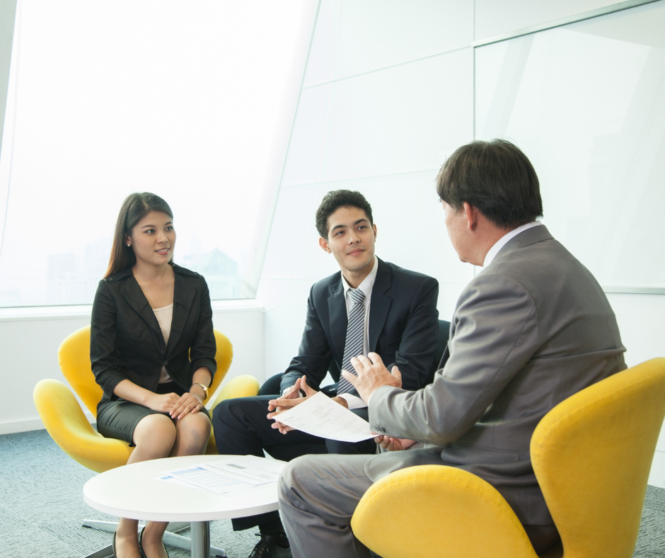 Three people in a business meeting.