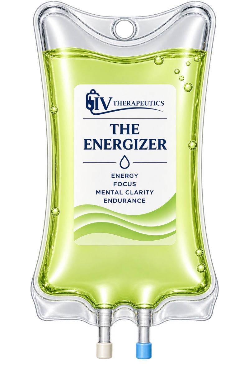 Clear IV fluid bag labeled “The Energizer” with light green liquid and dual tubing ports