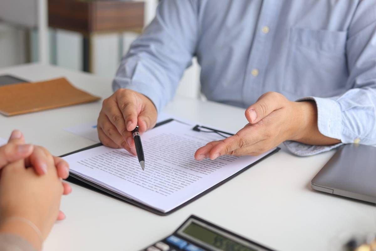A Social Security Disability lawyer reviewing information with a client.
