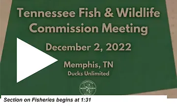 A green sign that says tennessee fish and wildlife commission meeting december 2 , 2022