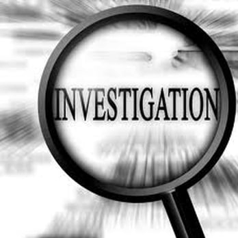 Magnifying glass over the word “INVESTIGATION” in bold black text, with a blurred grayscale background