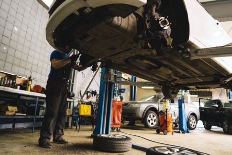 Car On A Lift In A Car Service — Algonac, MI — Clate's Performance Inc.