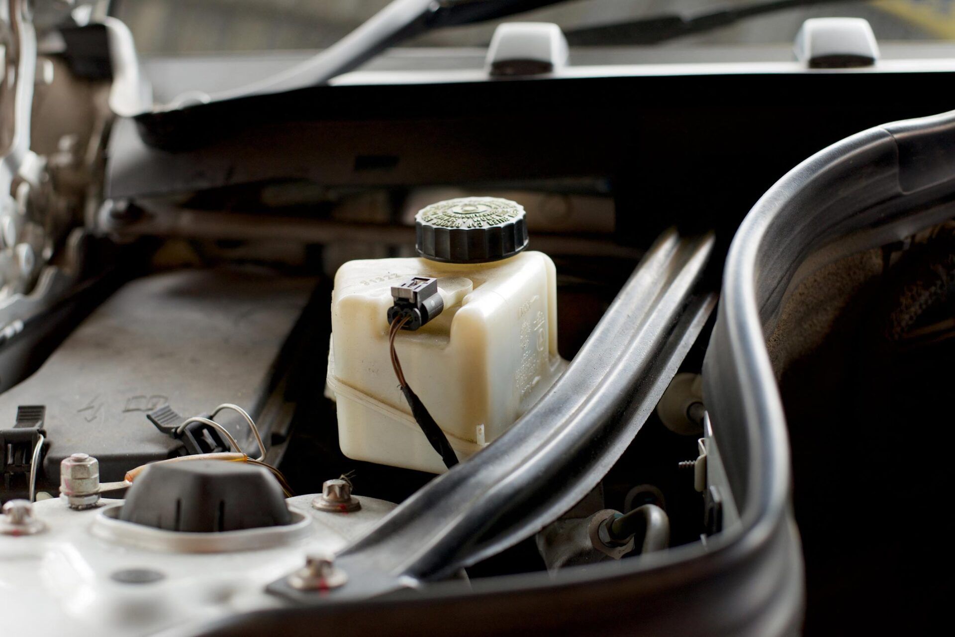 Disk Brakes Fluid Storage In The Car — Algonac, MI — Clate's Performance Inc. Disk Brakes Fluid Storage In The Car — Algonac, MI — Clate's Performance Inc.