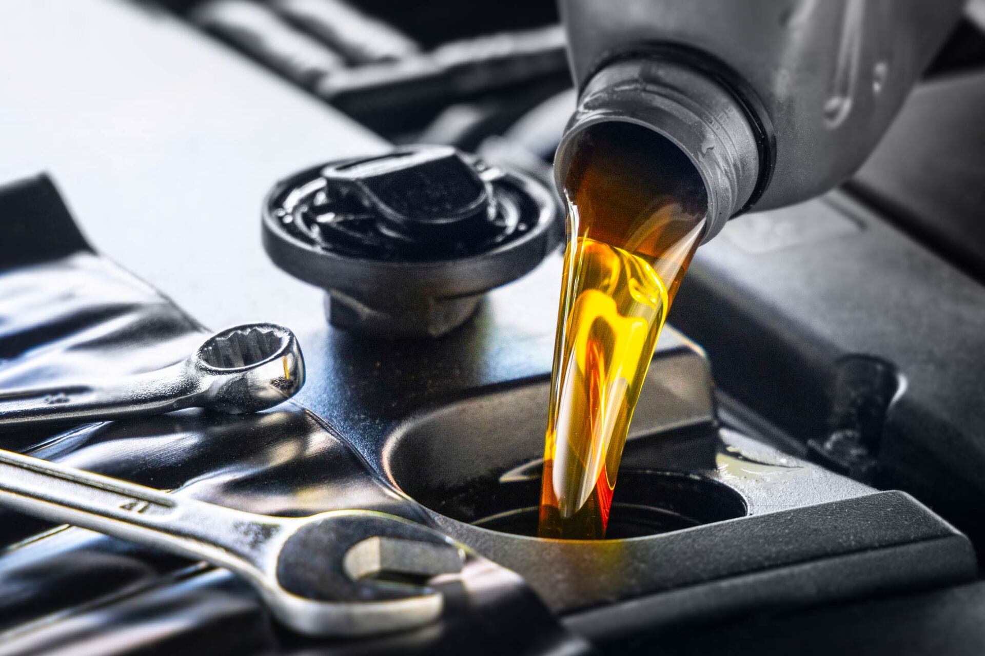 Pouring Motor Oil For Motor Vehicles — Algonac, MI — Clate's Performance Inc. Pouring Motor Oil For Motor Vehicles — Algonac, MI — Clate's Performance Inc.
