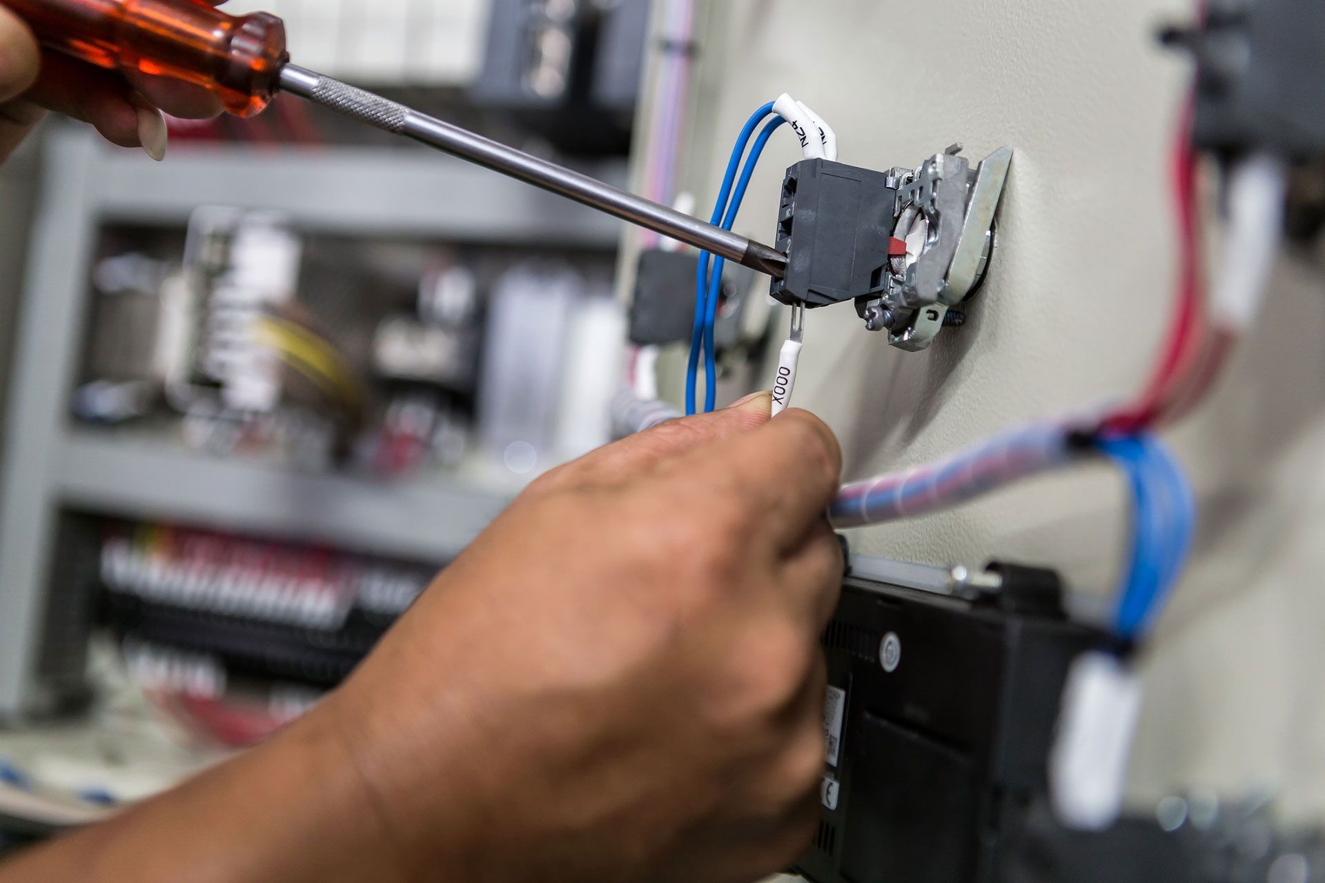 Electrician fixing home electricity panel