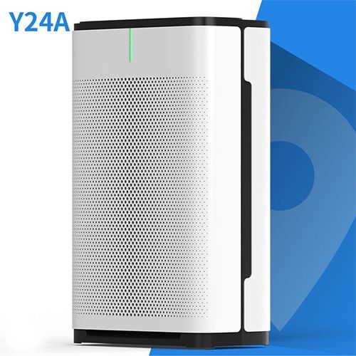 A white air purifier is sitting on top of a blue surface.