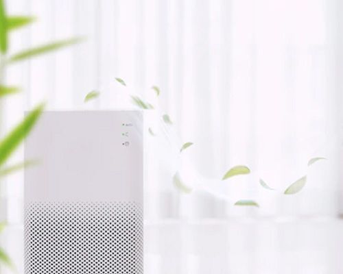 A white air purifier is sitting in front of a window with leaves flying out of it.
