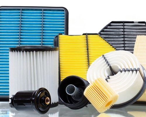 A bunch of different types of filters are sitting on a table