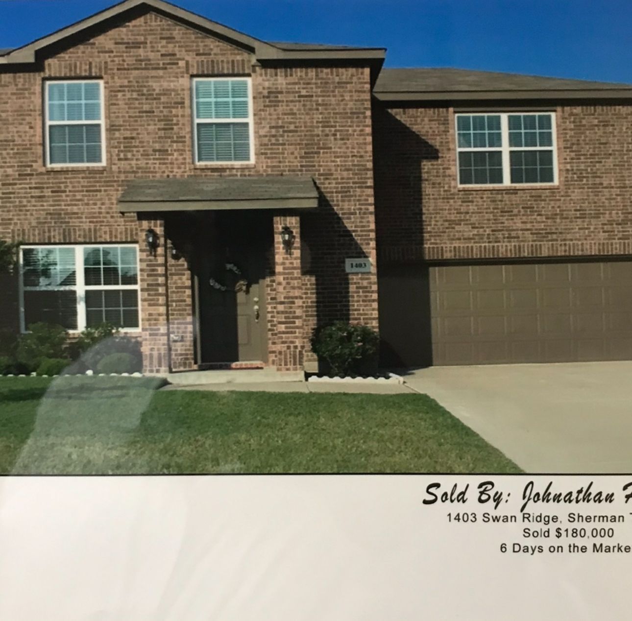 Two-story brick house with garage. Brown door, windows. Sold listing: 1403 Swan Ridge, Sherman, TX.