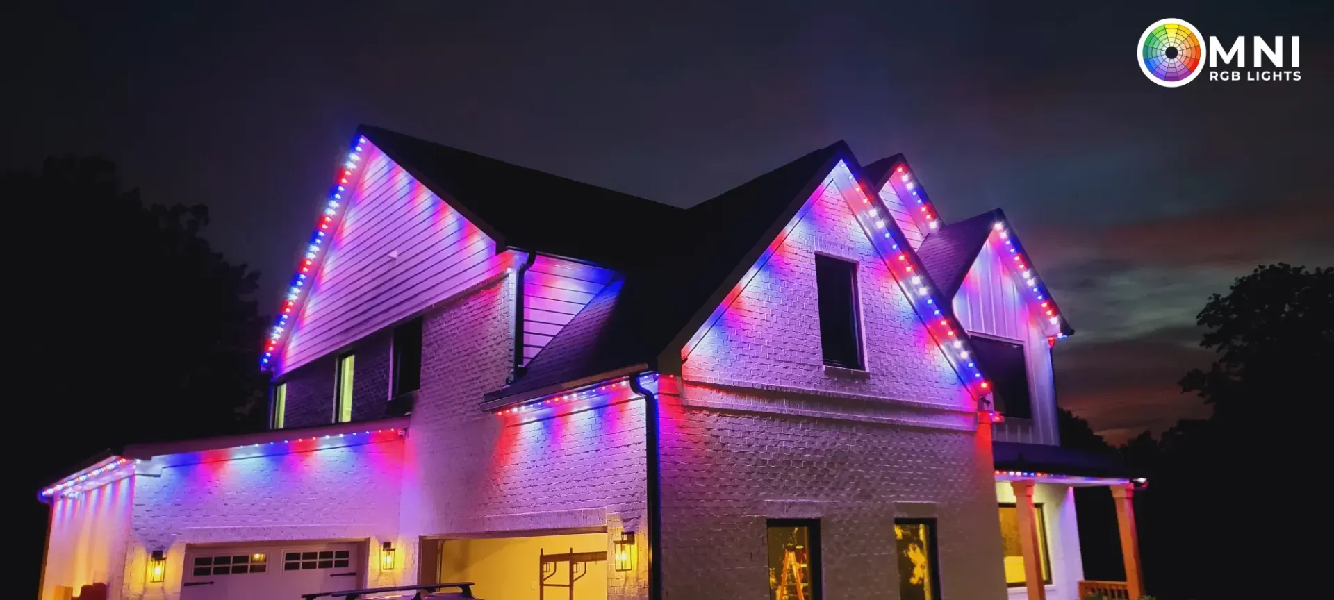 House with colorful purple and pink LED lights at dusk