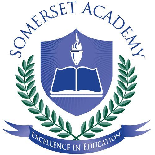 Somerset Academy logo: shield with book and torch, wreath, banner 
