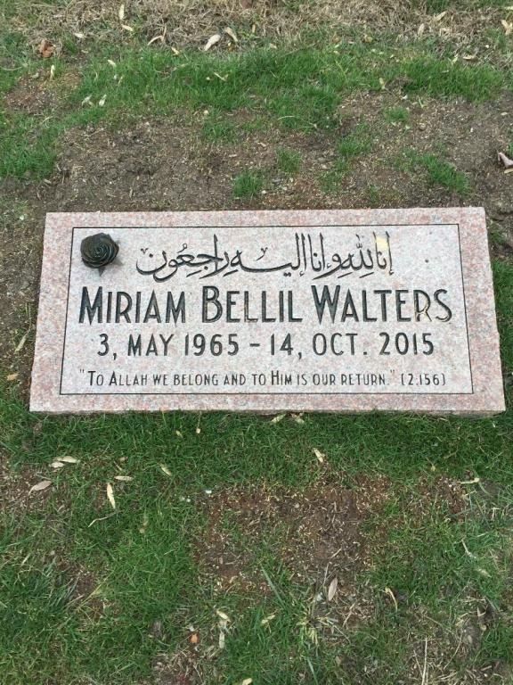 Gravestone of Miriam Bellil Walters, with Arabic script and English text, dates 1965-2015, set in grass.