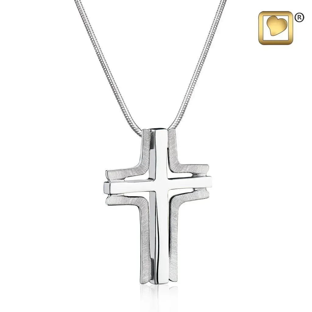 Silver cross pendant on a chain against a white background