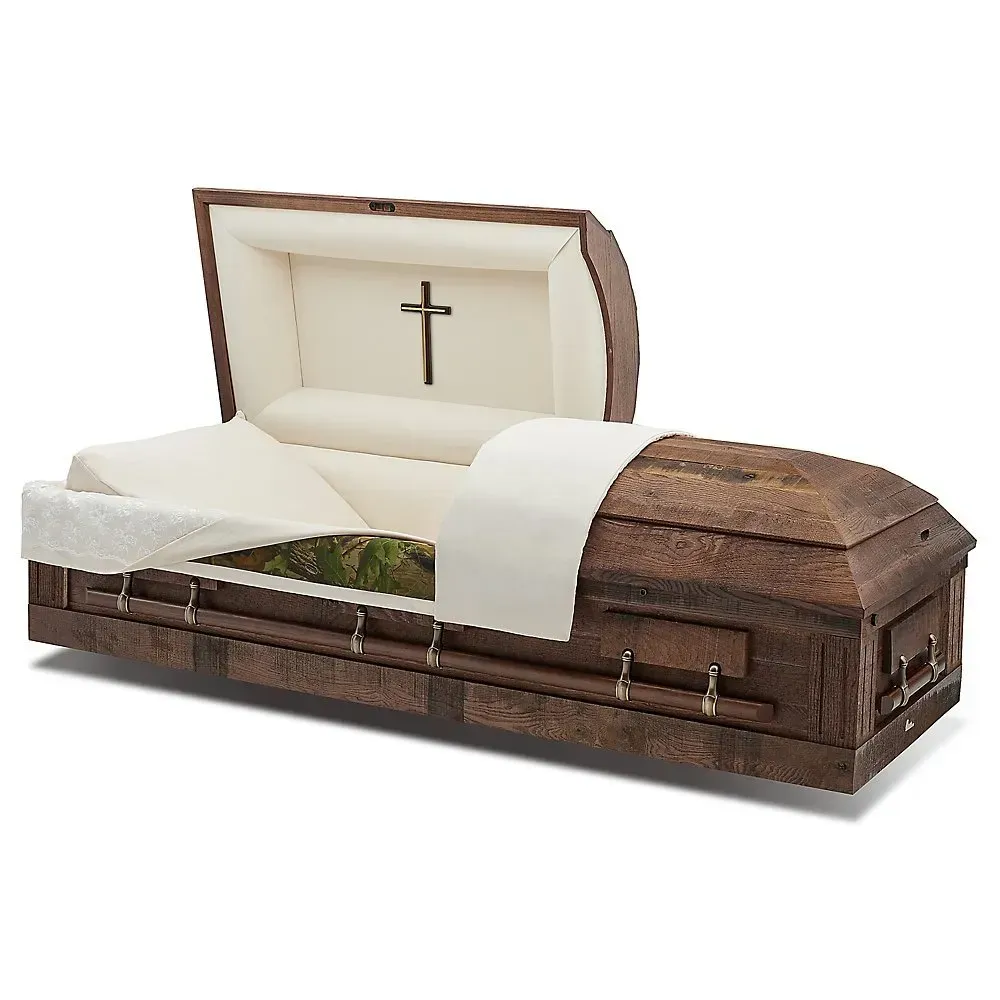 Wooden coffin with white interior lining and a cross on the open lid