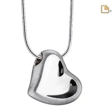 Heart-shaped silver pendant necklace on a chain