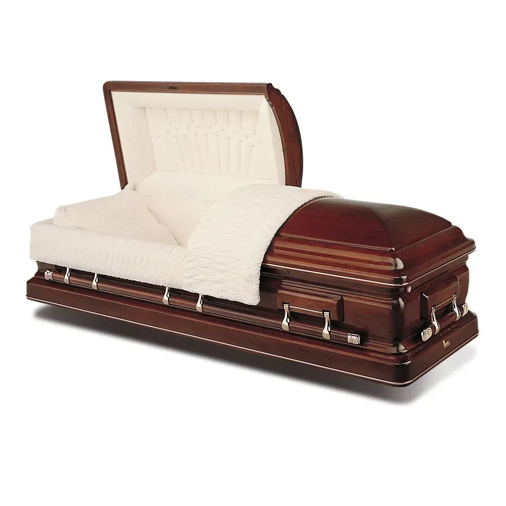 Open casket funeral coffin with white satin lining and a white blanket inside