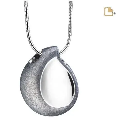 Silver teardrop pendant necklace with a black inset on a chain against a white background