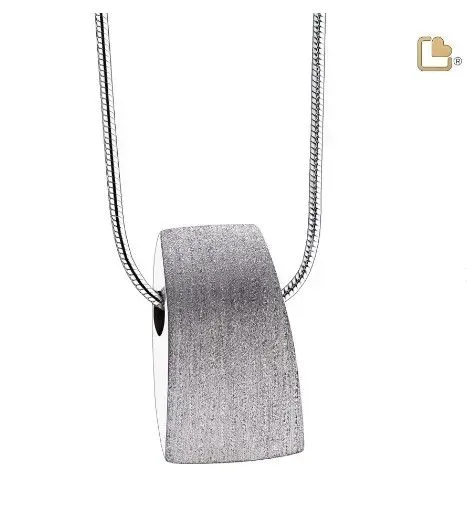 Silver pendant necklace with a textured rectangular charm on a chain