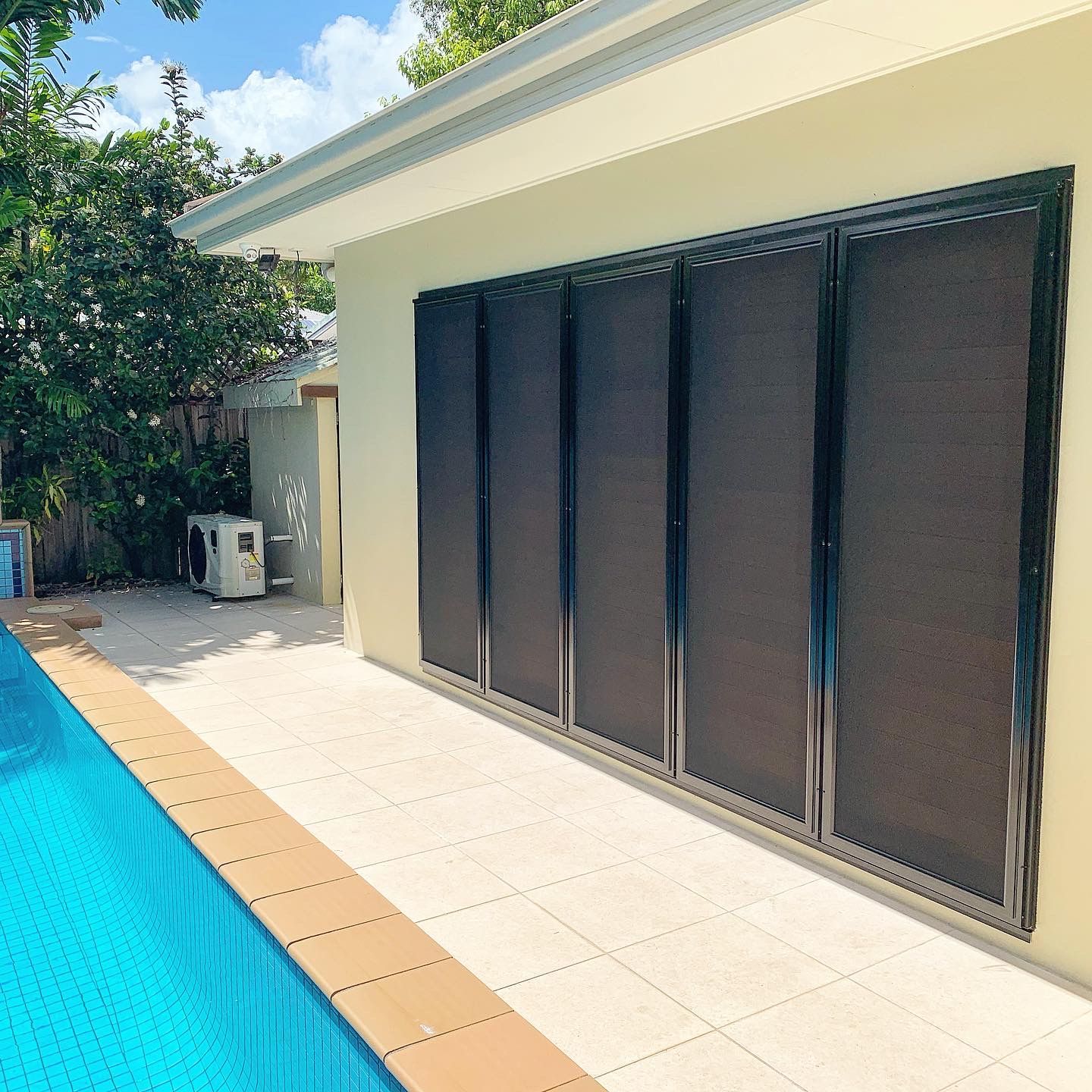A house with a swimming pool in the background