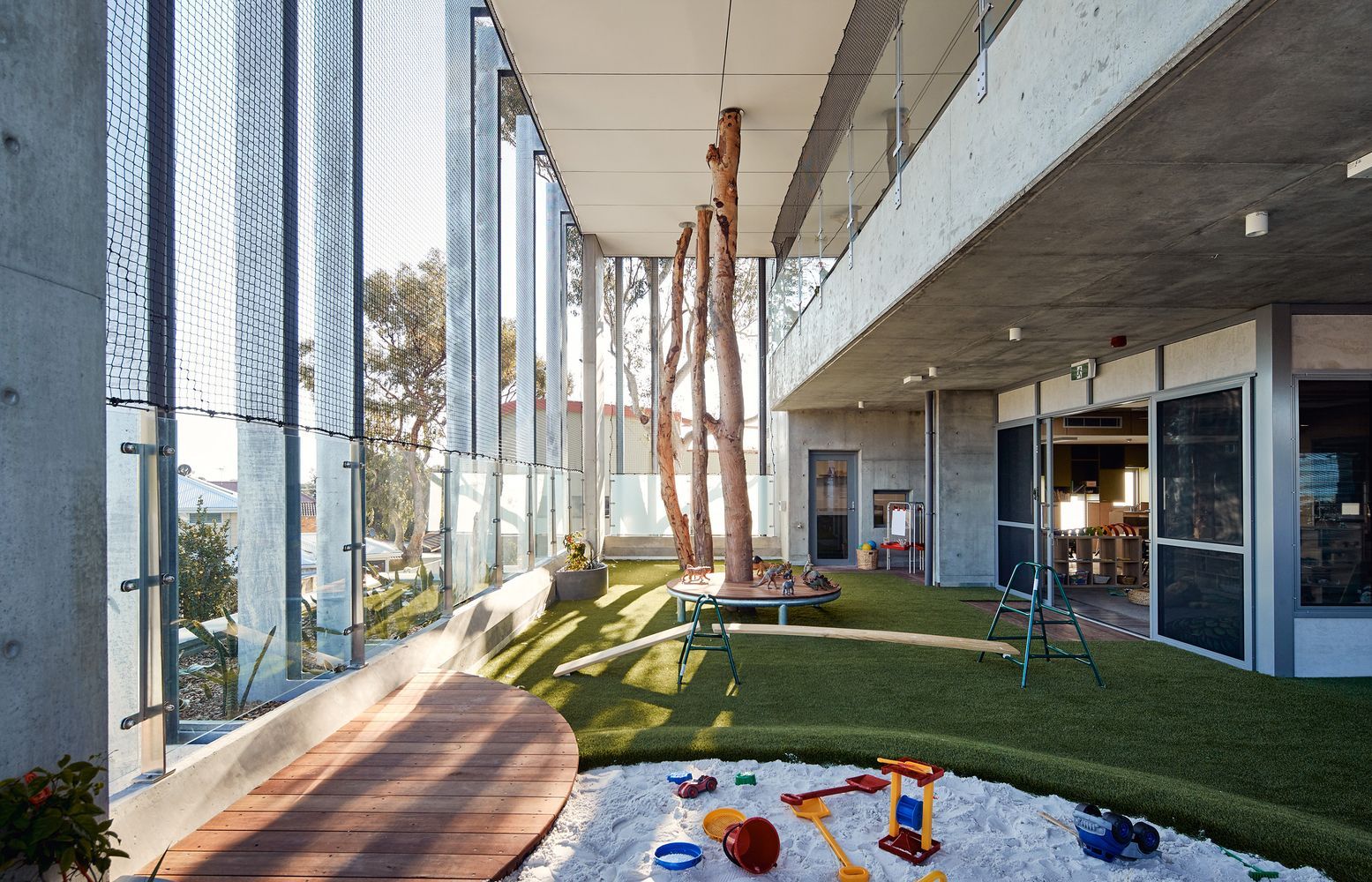 A large building with a sandbox in the middle of it