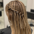 Foiled highlights woven through hair in warm studio light