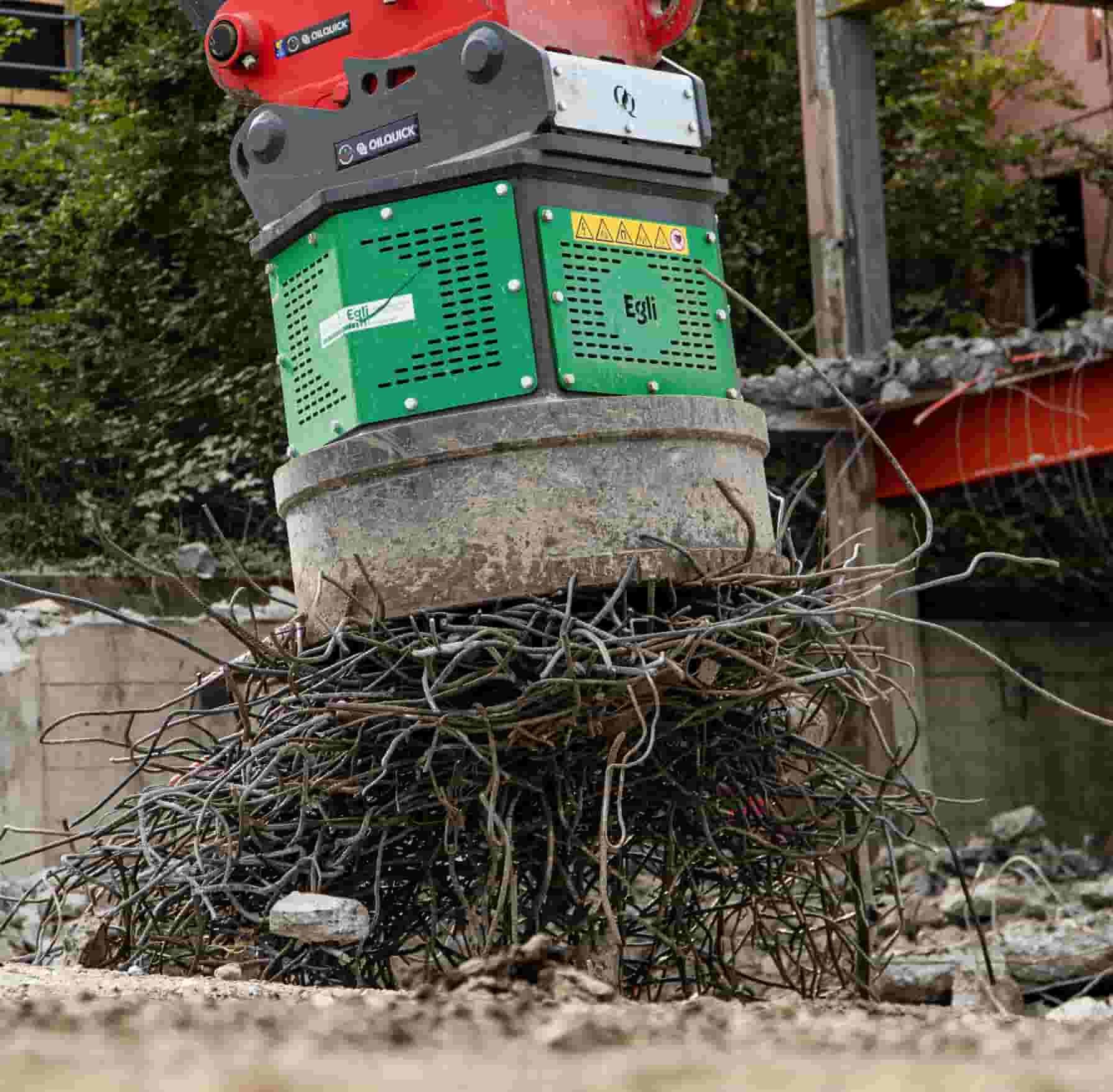 Egli hydraulic magnet separating rebar and reinforcement wires from concrete rubble at a demolition site, supplied by Harrybilt Engineering