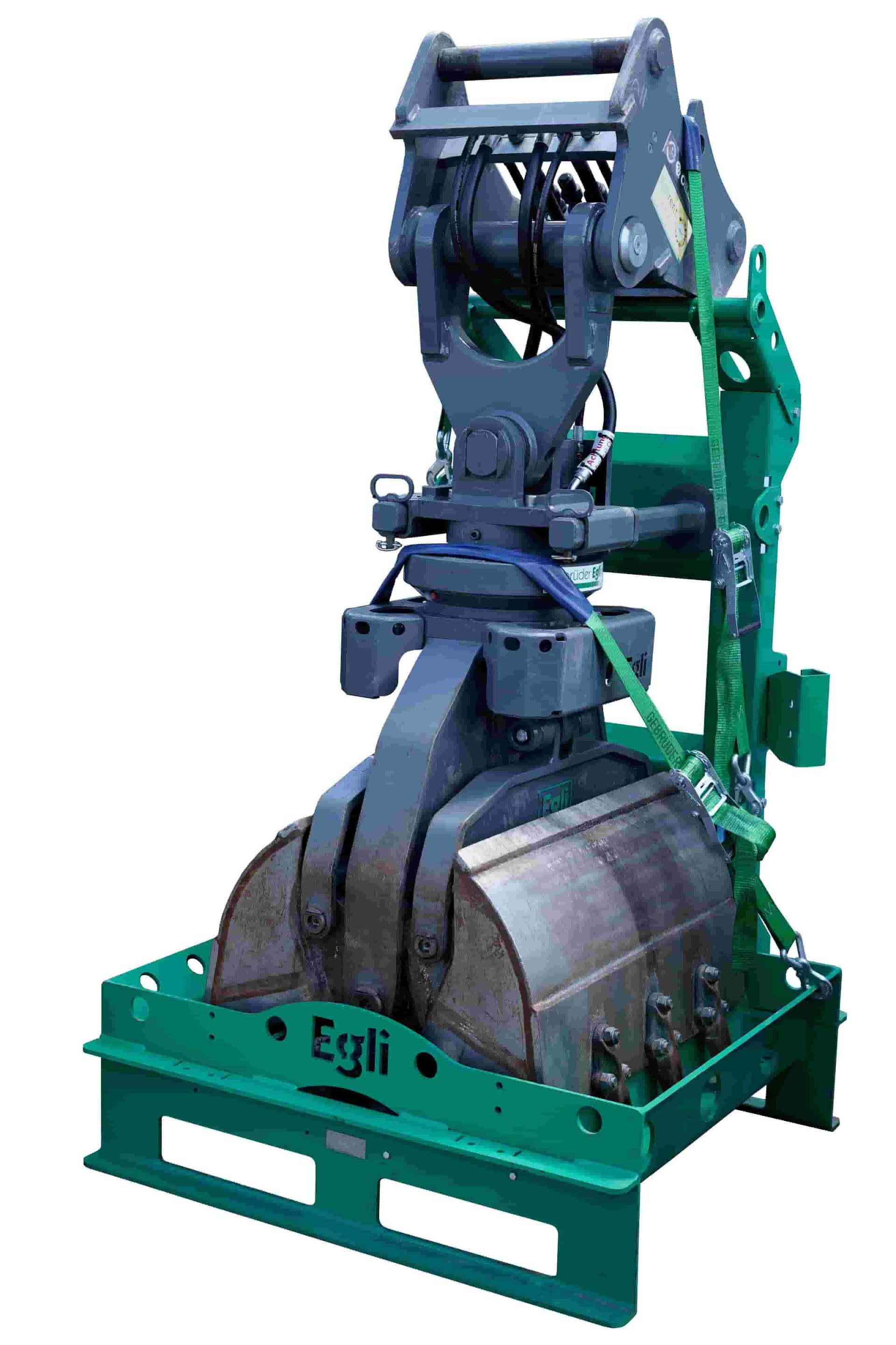 Egli mast foundation grapple in its steel transport carrier on a plain background, supplied by Harrybilt Engineering