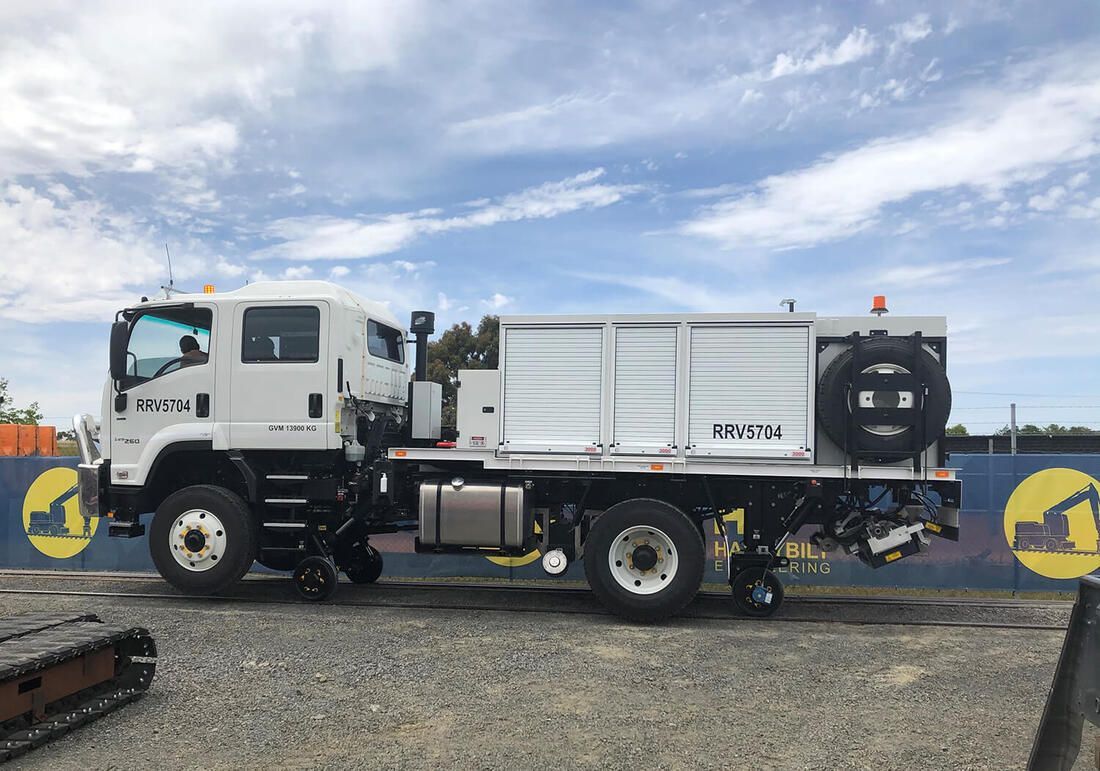 Road-rail service truck undergoing testing on Harrybilt's rail test track.