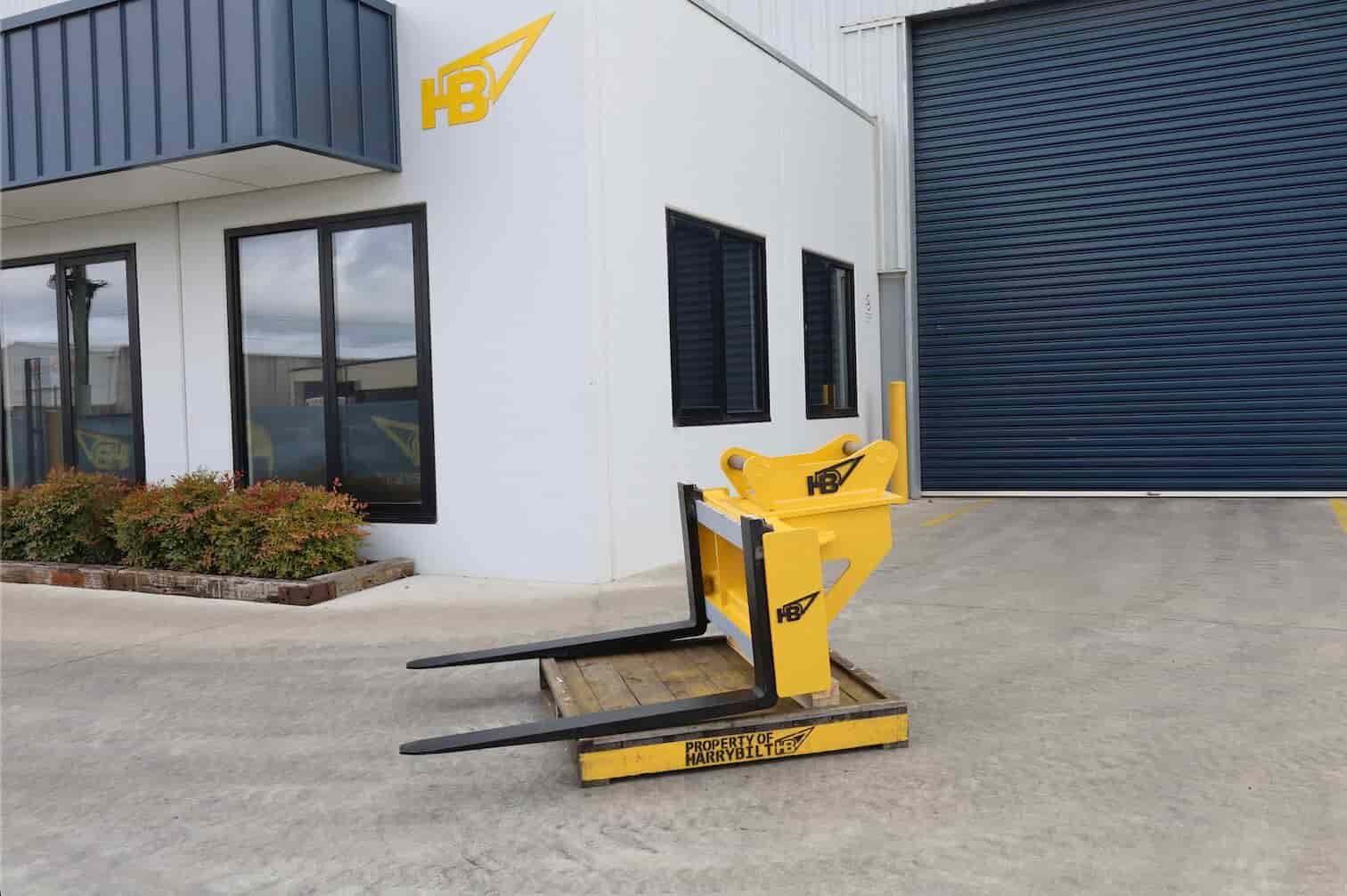 Heavy duty pallet forks by Harrybilt displayed outside