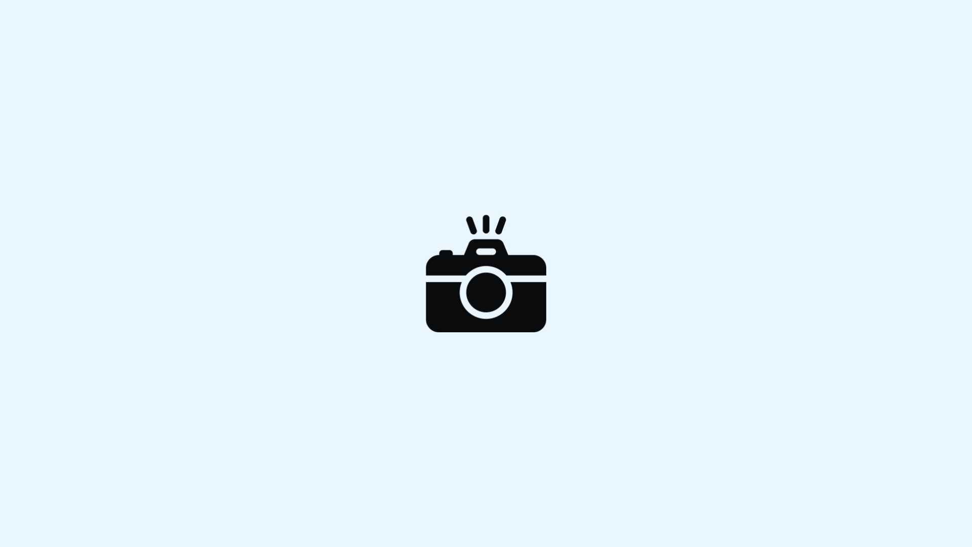 Black camera icon on a light blue background with flash marks above it