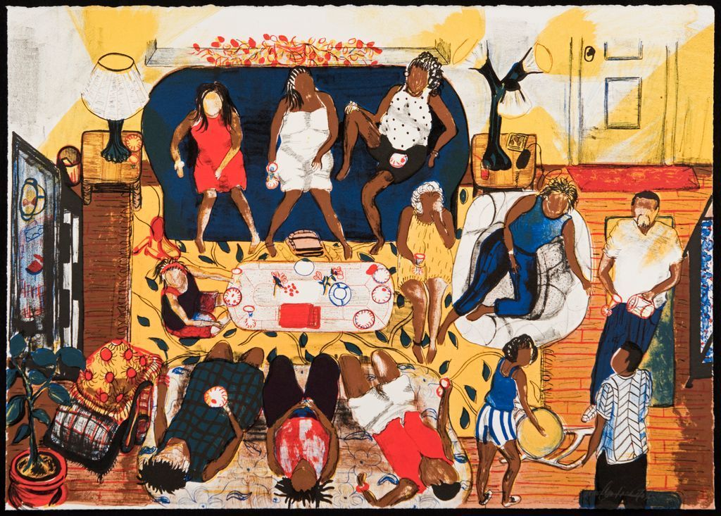 Crowded indoor scene with people dancing and posing around a table in a colorful room