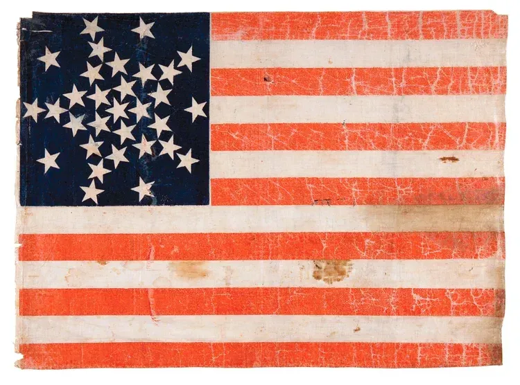 45-star American flag with red and white stripes and a blue star field.
