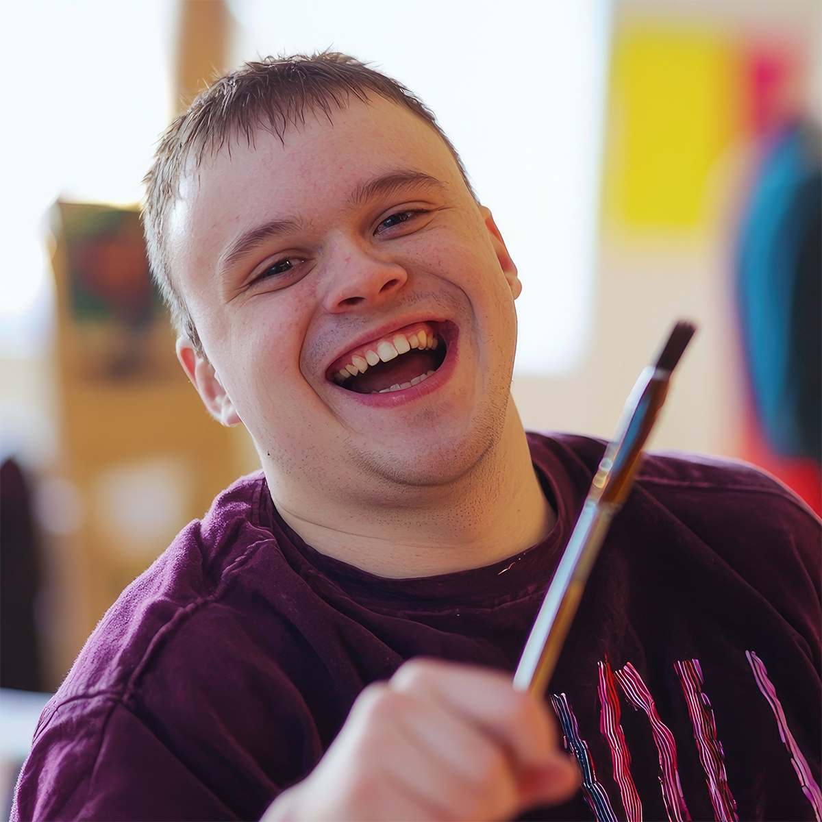 Elleisha's Property Services and Support (EPSS) NDIS community participation - participant happy to be enjoying a hobby