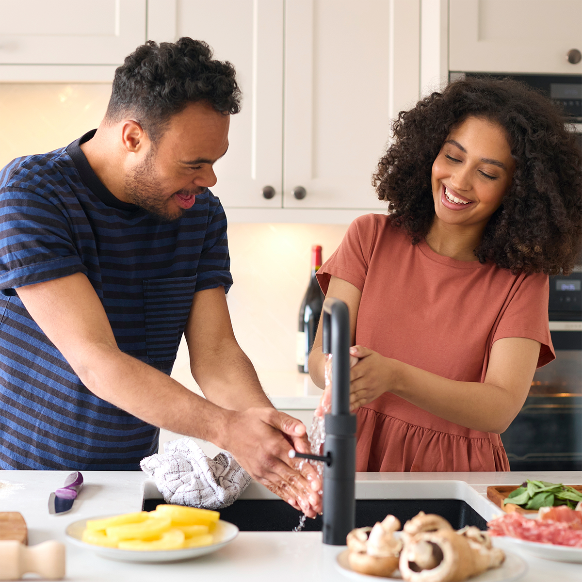 Elleisha's Property Services and Support (EPSS) NDIS daily living support worker in Wollongong helping a participant in the kitchen, food preparation