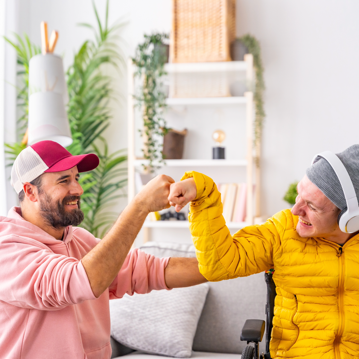 Elleisha's Property Services and Support (EPSS) NDIS e support worker in Wollongong bonding fist pump with an NDIS participant