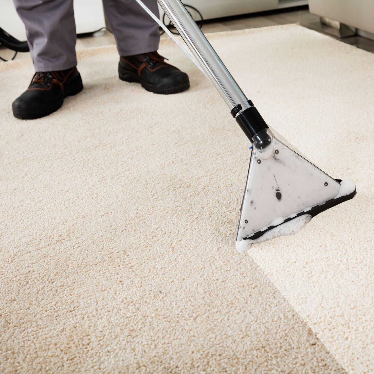 Elleisha's Property Services & Support (EPSS) cleaner doing professional carpet cleaning