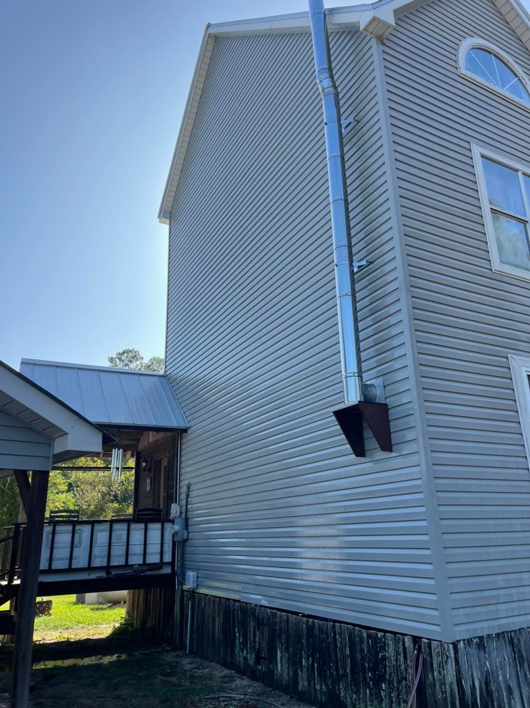 exterior cleaning a wooden deck