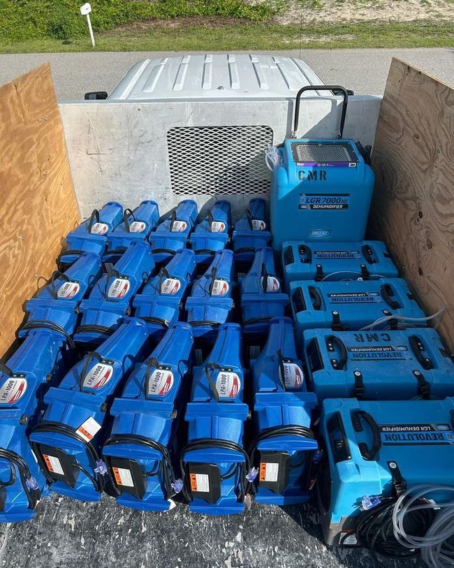 Industrial drying equipment on water-damaged flooring